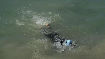 Malaga, Spain, 2017 - Swimmer coming to the end of the route in a competition swimming in a lake video