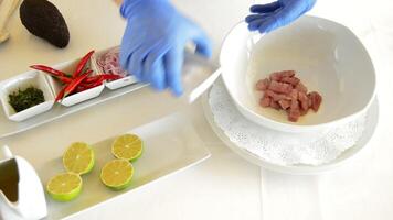 Hands of professional chef adding ingredients to make ceviche video