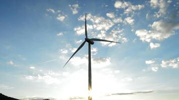 Wind turbine energy renewable moving at sunset video