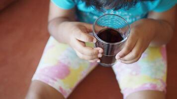 child drinking glass of soft drinks video