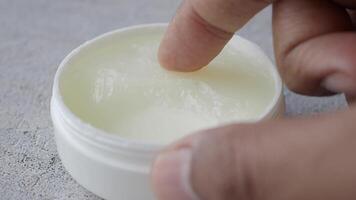 Close up of man hand using petroleum jelly video