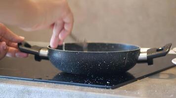 cooking pan on electric stove, electric stove is heated to red. video