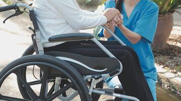 young asian physical therapist working with senior woman on walking with a walker video