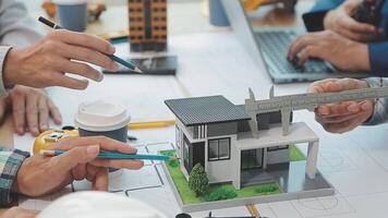 Architector and engineers with draft plan of building and tablet talking on constructing site. Construction manager and engineer working on building site. video