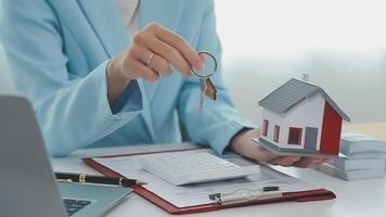 Real estate broker agent being analysis and making the decision a home estate loan to customer to signing contract documents for realty purchase, Bank employees recommend mortgage loan approval. video