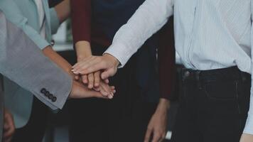 Young business people shaking hands in the office. Finishing successful meeting. Three persons. Wide screen panoramic video