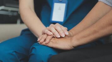 Emotional comfort stored in fingerprints. Shot of an unrecognizable doctor holding hands with her patient during a consultation. video