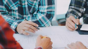 Architector and engineers with draft plan of building and tablet talking on constructing site. Construction manager and engineer working on building site. video