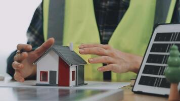 Architector and engineers with draft plan of building and tablet talking on constructing site. Construction manager and engineer working on building site. video