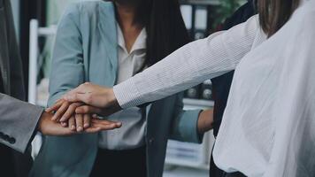 Young business people shaking hands in the office. Finishing successful meeting. Three persons. Wide screen panoramic video