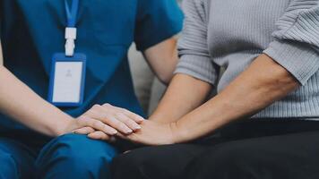 Emotional comfort stored in fingerprints. Shot of an unrecognizable doctor holding hands with her patient during a consultation. video