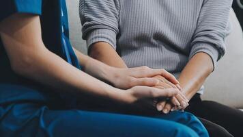 Emotional comfort stored in fingerprints. Shot of an unrecognizable doctor holding hands with her patient during a consultation. video