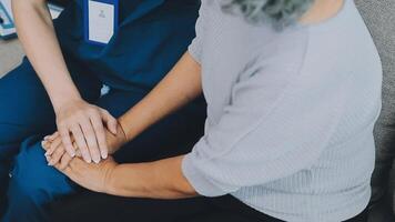 Emotional comfort stored in fingerprints. Shot of an unrecognizable doctor holding hands with her patient during a consultation. video