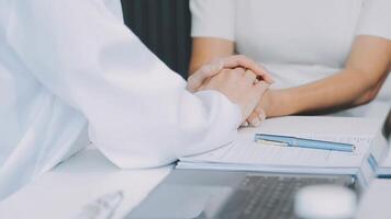 Emotional comfort stored in fingerprints. Shot of an unrecognizable doctor holding hands with her patient during a consultation. video