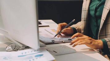 Business woman using calculator for do math finance on wooden desk in office and business working background, tax, accounting, statistics and analytic research concept video