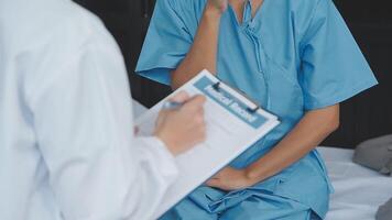 Doctor and patient discussing something while sitting at the table . Medicine and health care concept. Doctor and patient video