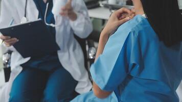 Doctor and patient discussing something while sitting at the table . Medicine and health care concept. Doctor and patient video