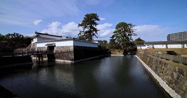 The gate of Odawara castle in Kanagawa sunny day wide shot panning video