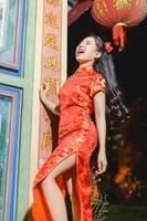 Asian beautiful woman Dress in Chinese style, Chinese New Year festival at night photo