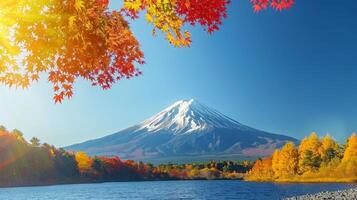 AI generated Snow capped mtfuji  tokyo s tallest volcano with autumn red trees, perfect backdrop for wallpapers photo
