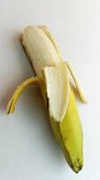 opened yellow banana on a white background photo