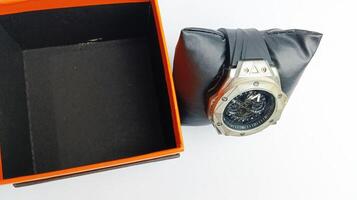 watch and cardboard holder on white background photo