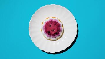 Cake with strawberries on a plate, light blue background. Top view, flat lay, copy space photo