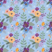 Flowers and leaf design on blue background seamless pattern. vector