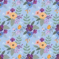 Flowers and leaf design on blue background seamless pattern. vector