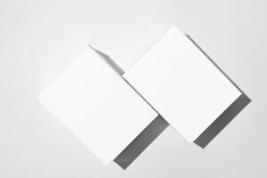 Two white blank boxes mock up. Small cardboard boxes on a light background photo