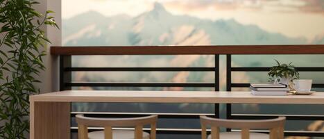 A wooden table on the balcony with a beautiful view of snow-capped mountains. photo