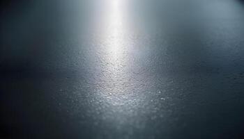 a close up of a shiny surface with water droplets photo