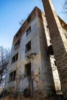 Hungarian aged lost place in the forest. Ex soviet, abandoned army base barracks and associated buildings. photo