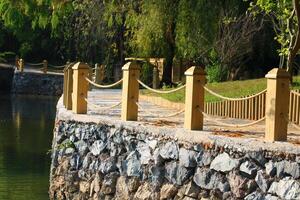 rope railing made of wood. wooden fence photo