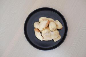 Durian riped and fresh ,durian peel on black plate photo