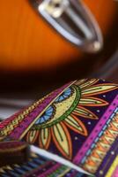 The guitar belt with ethnic Indonesian photo