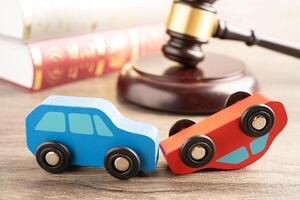 Hammer gavel judge with car vehicle accident, insurance coverage claim lawsuit court case. photo