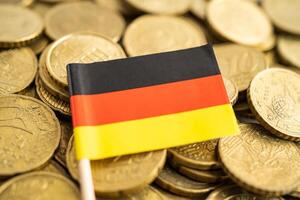 Germany flag on coins money, finance and accounting, banking concept. photo