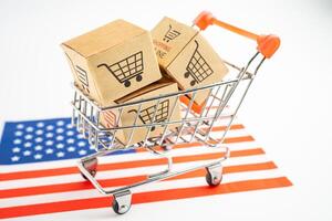 Box with shopping online cart logo and USA America flag, Import Export Shopping online or commerce finance delivery service store product shipping, trade, supplier. photo