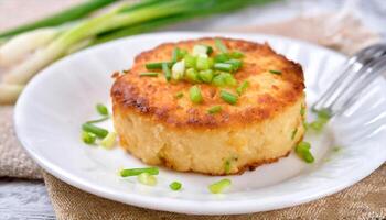 AI generated a small piece of potato cake with green onions on it photo