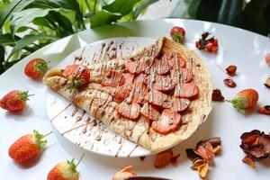 Pepperoni Pizza With Strawberries on a Plate photo