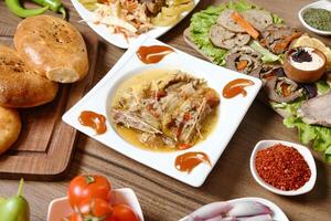 Wooden Table With Plates of Food photo