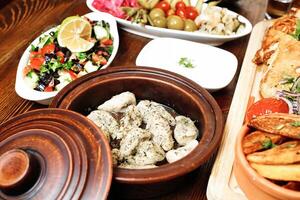 Wooden Table Displaying an Array of Delicious Food photo