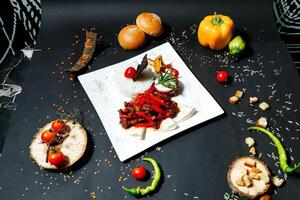 Deliciously Plated Food on Black Table photo