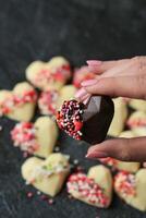 Hand Holding Heart-Shaped Food, An Expression of Love photo
