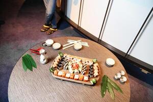 Wooden Table With Platter of Food photo