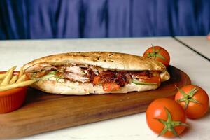 Sandwich and French Fries on a Cutting Board photo