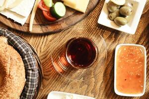 Wooden Table Displaying Plates of Food photo