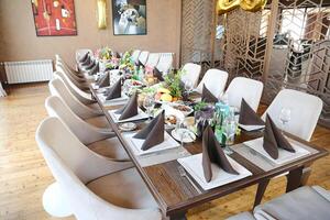 Spacious Long Table With Multiple Chairs for Gatherings photo