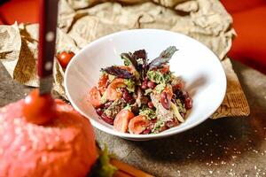 Delicious Bowl of Food Resting on Wooden Table photo